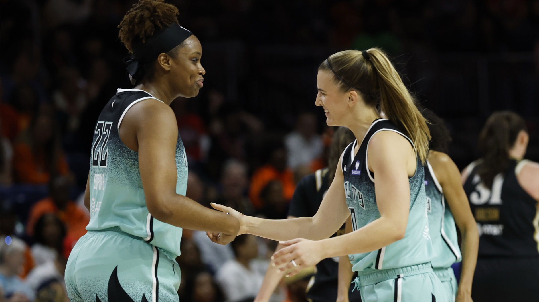 New York Liberty forward Kennedy Burke (22) celebrates with Liberty guard Sabrina Ionescu (20) against the Washington Mystics in the second half at Entertainment & Sports Arena.