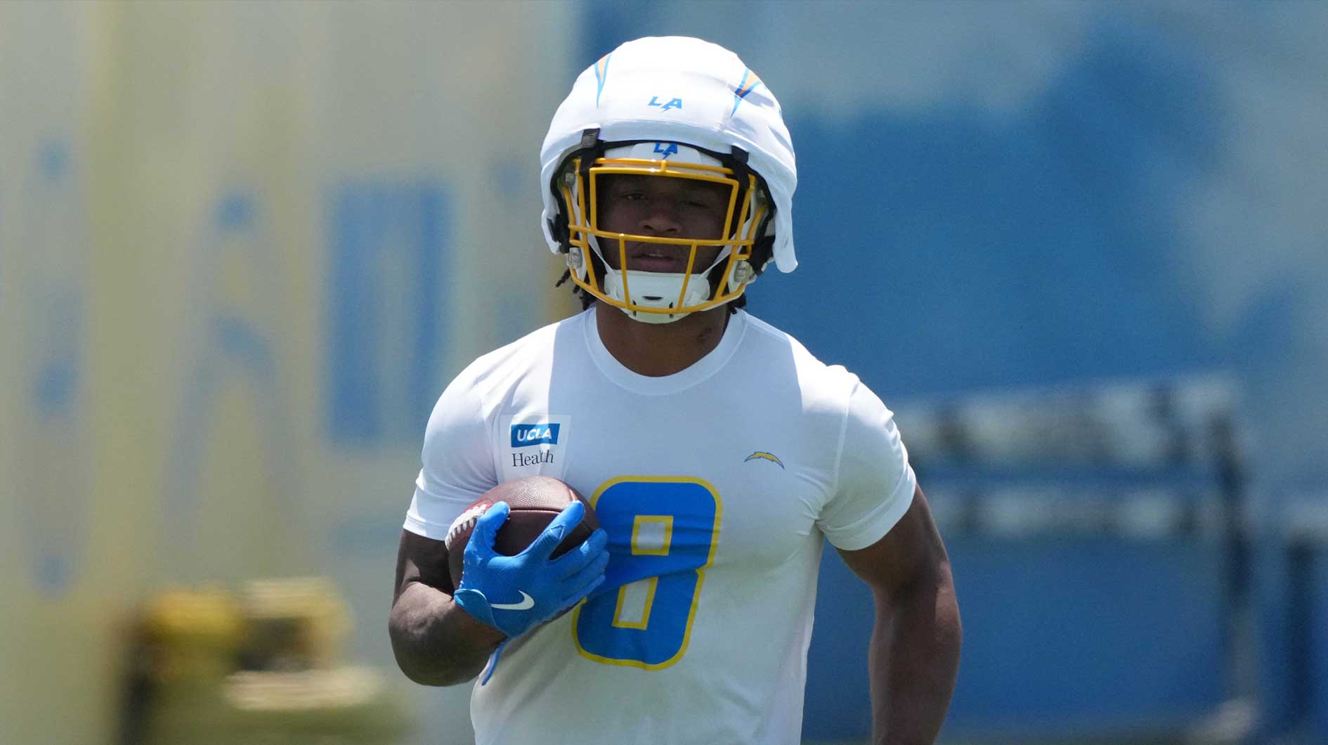 Los Angeles Chargers running back Omarion Hampton (8) carries the ball during organized team activities at The Bolt.