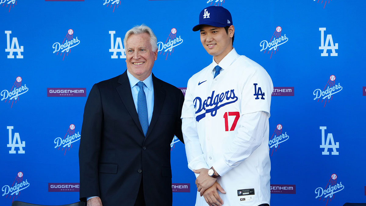 Los Angeles Dodgers designated hitter Shohei Ohtani (17) poses with owner Mark Walter at press conference at Dodger Stadium.