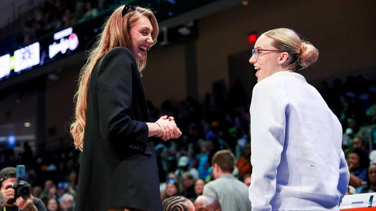 Los Angeles Sparks forward Cameron Brink (left) speaks with Dallas Wings guard Paige Bueckers (right) before the game at College Park Center.