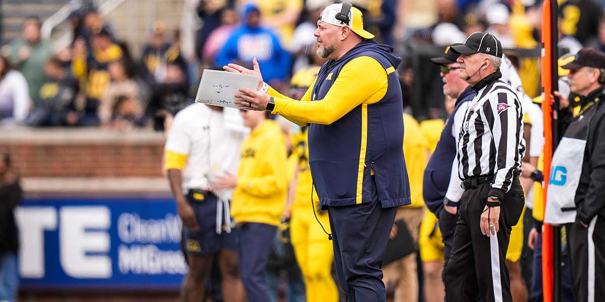 Michigan defensive line coach Lou Esposito watches a play against Team Blue during the second half of the spring game at Michigan Stadium