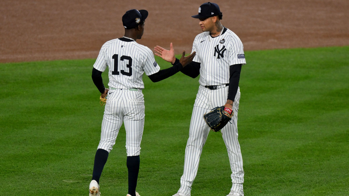 New York Yankees third baseman Jazz Chisholm Jr. (13) and pitcher Luis Gil (81) before the first inning in game four of the 2024 MLB World Series against the Los Angeles Dodgers at Yankee Stadium.