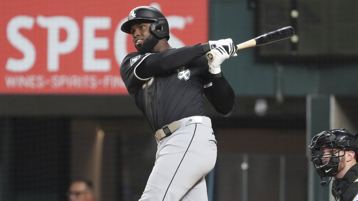 Chicago White Sox outfielder Luis Robert Jr. (88) follows through on his RBI single against the Texas Rangers during the fifth inning at Globe Life Field
