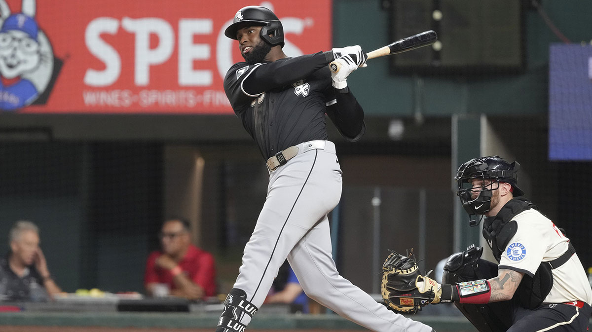 Chicago White Sox outfielder Luis Robert Jr. (88) follows through on his RBI single against the Texas Rangers during the fifth inning at Globe Life Field.