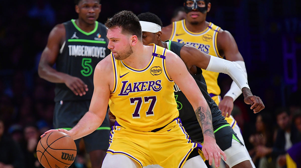 Los Angeles Lakers guard Luka Doncic (77) controls the ball against the Minnesota Timberwolves during the second half in game five of first round for the 2025 NBA Playoffs at Crypto.com Arena.
