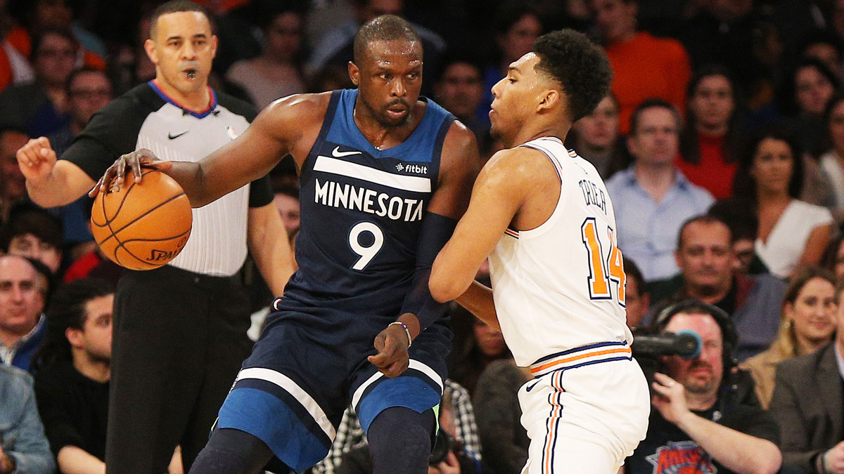 Minnesota Timberwolves forward Luol Deng (9) dribbles the ball as New York Knicks guard Allonzo Trier (14) defends during the second half at Madison Square Garden.