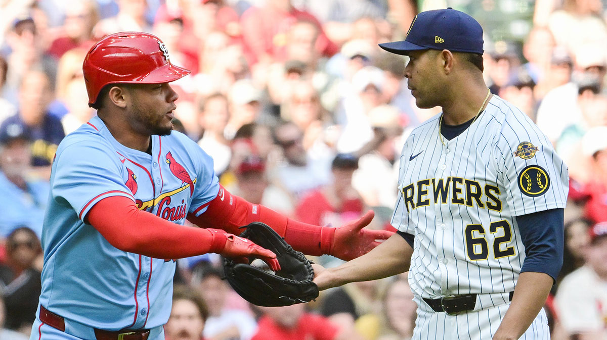 St. Louis Cardinals first baseman Willson Contreras (40) hands the ball back to Milwaukee Brewers starting pitcher Jose Quintana (62) after being hit by a pitch in the fifth inning at American Family Field.