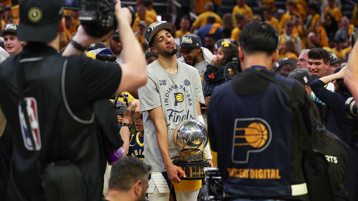 Indiana Pacers guard Tyrese Haliburton (0) holds the trophy after game six of the eastern conference finals against the New York Knicks for the 2025 NBA Playoffs at Gainbridge Fieldhouse.