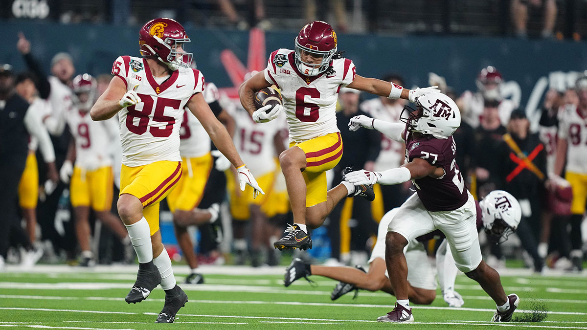Southern California Trojans wide receiver Makai Lemon (6) carries the ball against Texas A&M Aggies linebacker Daymion Sanford (27) in the second half at Allegiant Stadium.
