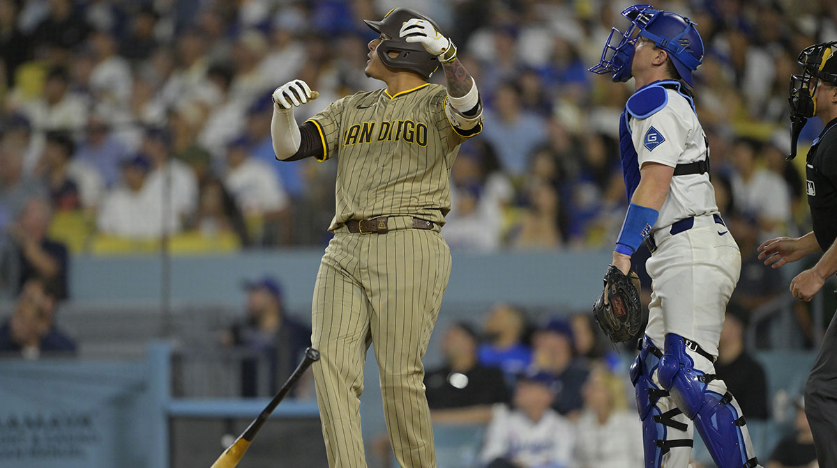 San Diego Padres third baseman Manny Machado (13) flips his bat after hitting a solo home run in the sixth inning against the Los Angeles Dodgers at Dodger Stadium.