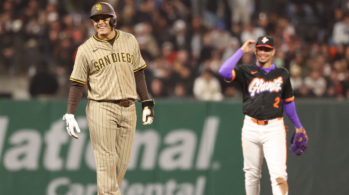 San Diego Padres third baseman Manny Machado (13) smiles with San Francisco Giants shortstop Willy Adames (2) between plays during the eighth inning at Oracle Park.
