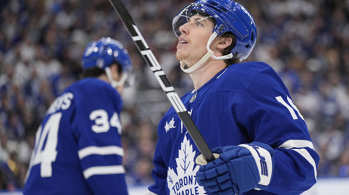 Toronto Maple Leafs forward Mitch Marner (16) looks up at the scoreboard as Toronto Maple Leafs forward Auston Matthews (34) skates to the bench during the third period of game seven of the second round of the 2025 Stanley Cup Playoffs against the Florida Panthers at Scotiabank Arena