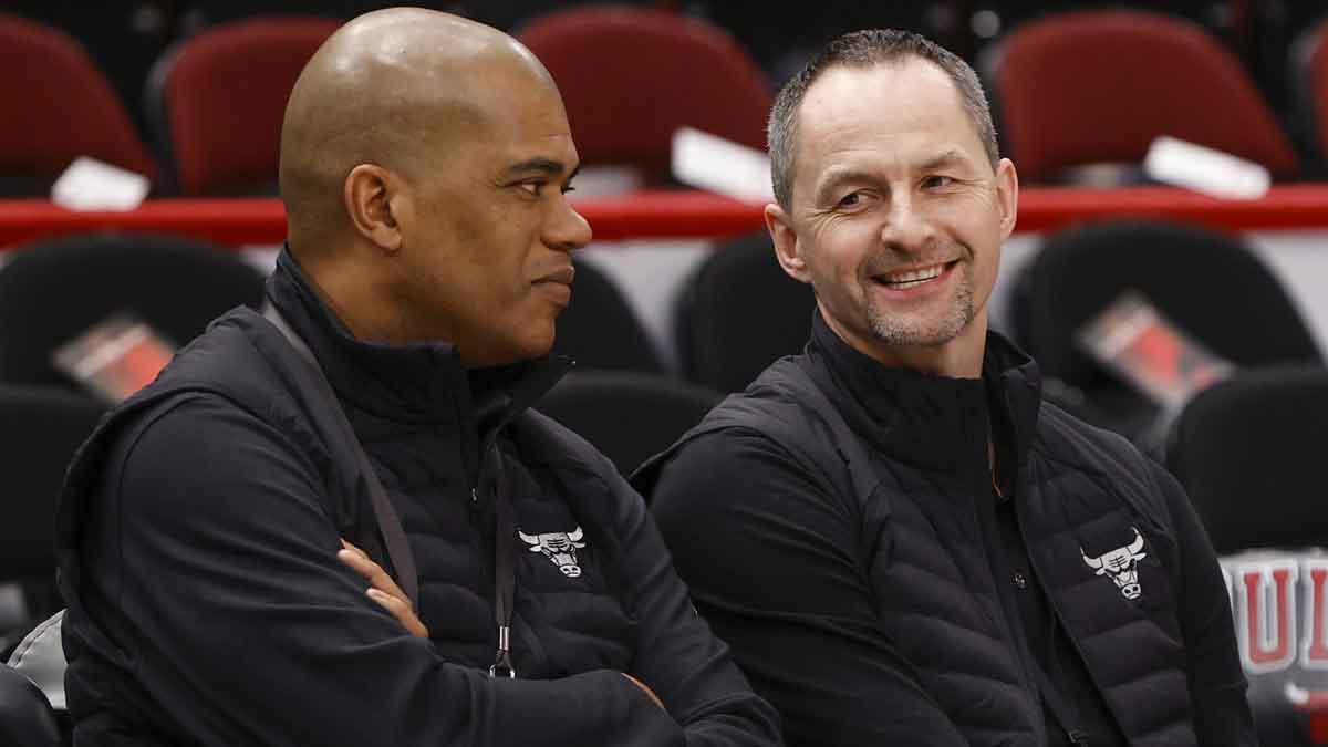 Chicago Bulls executive vice president of basketball operations Arturas Karnisovas (right) talks with general manager Marc Eversley (left) before game three of the first round for the 2022 NBA playoffs against the Milwaukee Bucks at United Center.