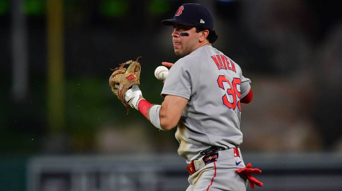 Boston Red Sox second baseman Marcelo Mayer (39) loses control of the ball for the throw to first against Los Angeles Angels center fielder Jo Adell (7). during the seventh inning at Angel Stadium.