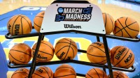 A rack of basketballs with the March Madness logo before that start of the UCLA Bruins - Ohio State Buckeyes game at Pauley Pavilion presented by Wescom.