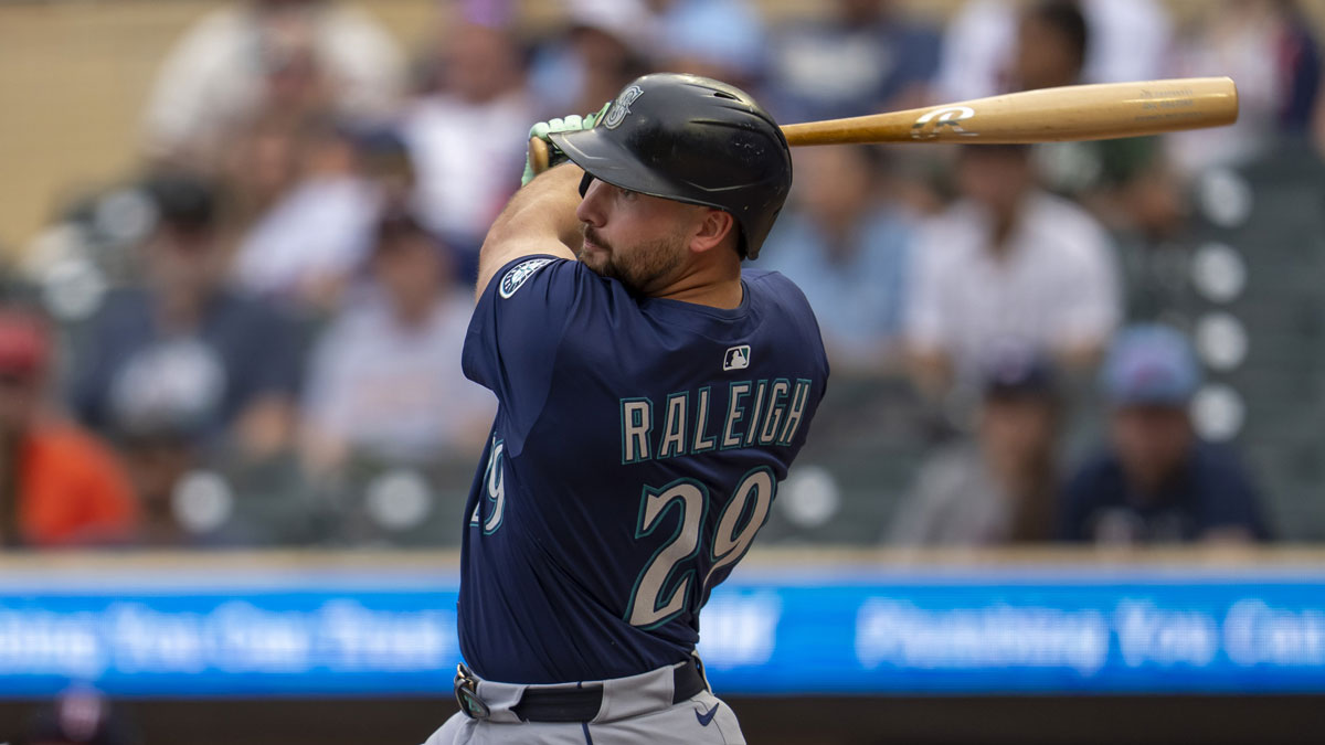 Seattle Mariners catcher Cal Raleigh (29) hits a double against the Minnesota Twins in the first inning at Target Field