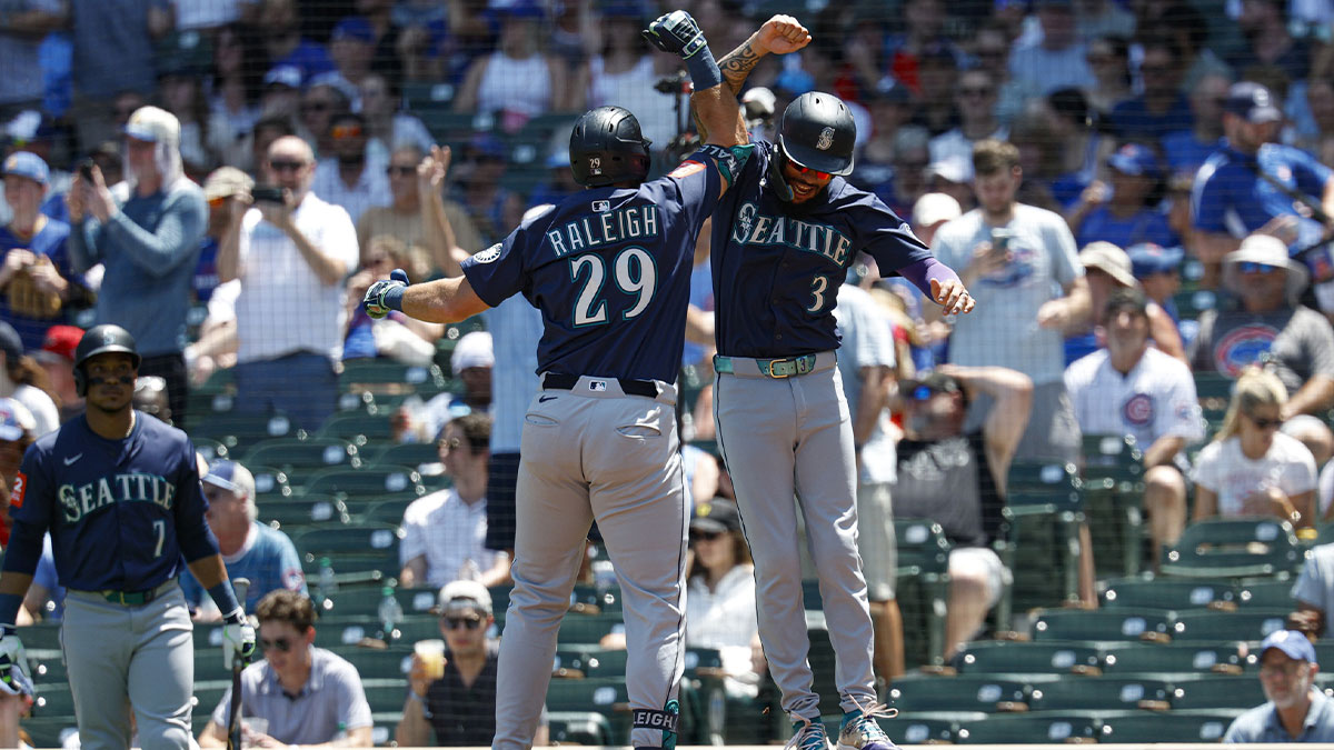 Seattle Mariners catcher Cal Raleigh (29) hits a two run home run against the Minnesota Twins in the ninth inning at Target Field.