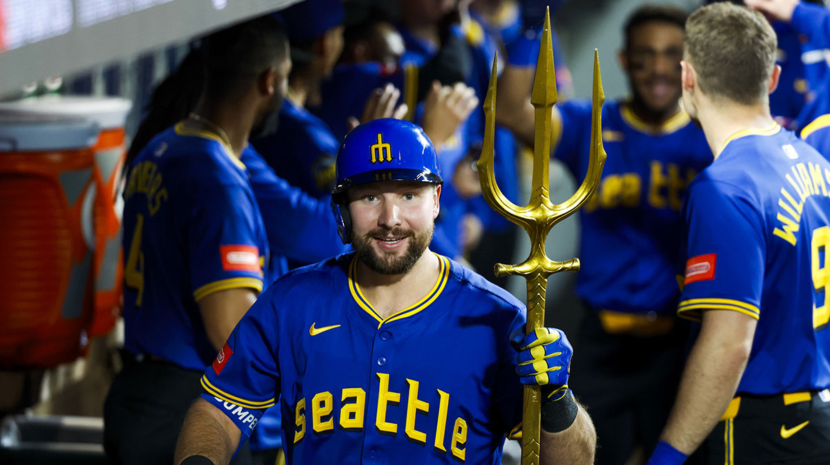 May 30, 2025; Seattle, Washington, USA; Seattle Mariners catcher Cal Raleigh (29) celebrates in the dugout after hitting a two-run home run against the Minnesota Twins during the eighth inning at T-Mobile Park. Mandatory Credit: Joe Nicholson-Imagn Images
