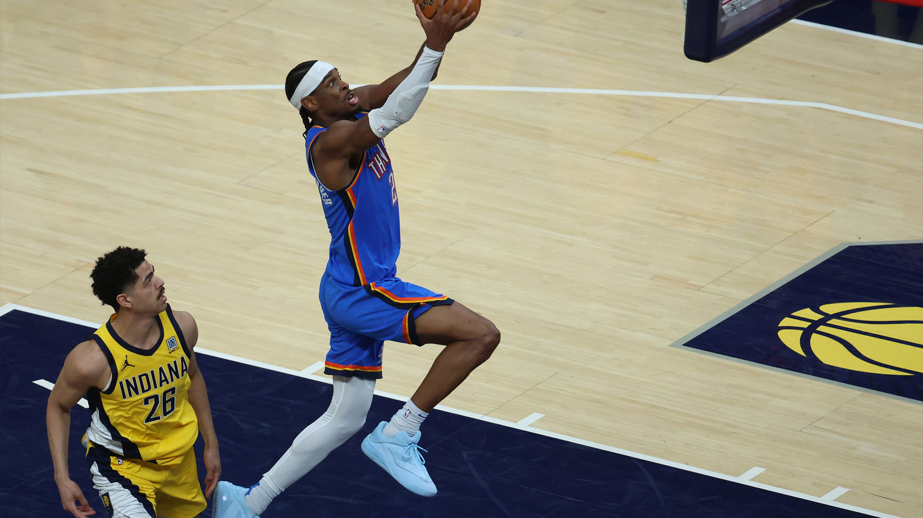 Oklahoma City Thunder guard Shai Gilgeous-Alexander (2) dunks past Indiana Pacers guard Ben Sheppard (26) during the third quarter against the Indiana Pacers during game four of the 2025 NBA Finals at Gainbridge Fieldhouse.