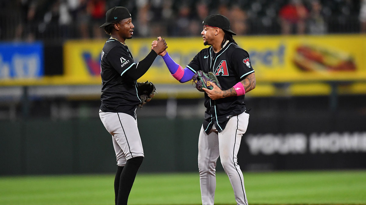 Arizona Diamondbacks shortstop Geraldo Perdomo (left) and second baseman Ketel Marte (right) celebrate after defeating the Chicago White Sox at Rate Field.