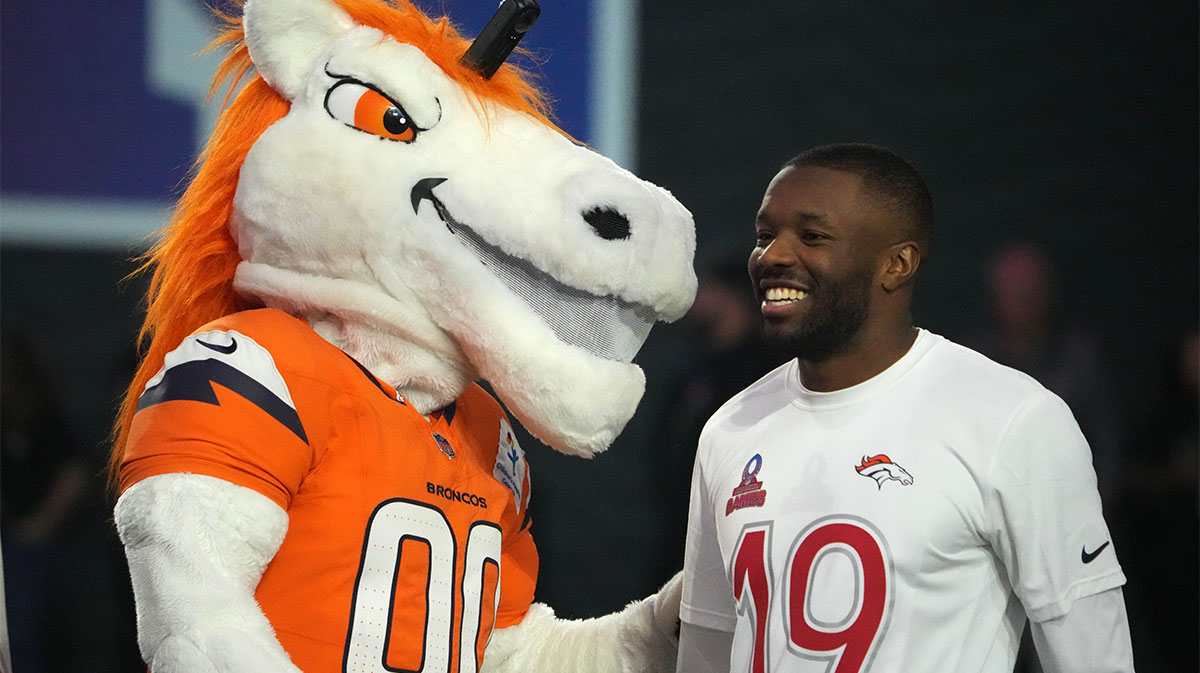 Denver Broncos mascot Miles (left) and Broncos special teams player Marvin Mims (19) during the Pro Bowl Skills Challenge at Nicholson Fieldhouse.