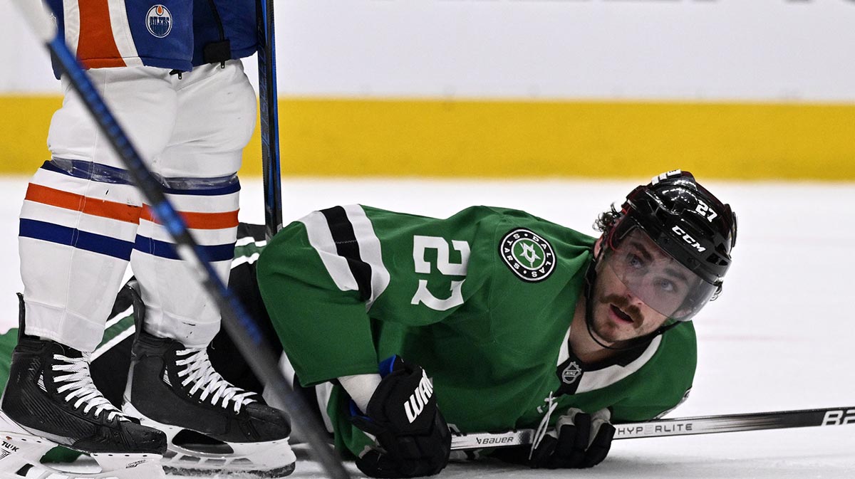 Dallas Stars left wing Mason Marchment (27) reacts after being knocked to the ice against the Edmonton Oilers in the second period during game one of the Western Conference Final of the 2025 Stanley Cup Playoffs at American Airlines Center.