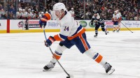 New York Islanders center Bo Horvat (14) wrists a shot on goal against the Columbus Blue Jackets during the third period at Nationwide Arena.