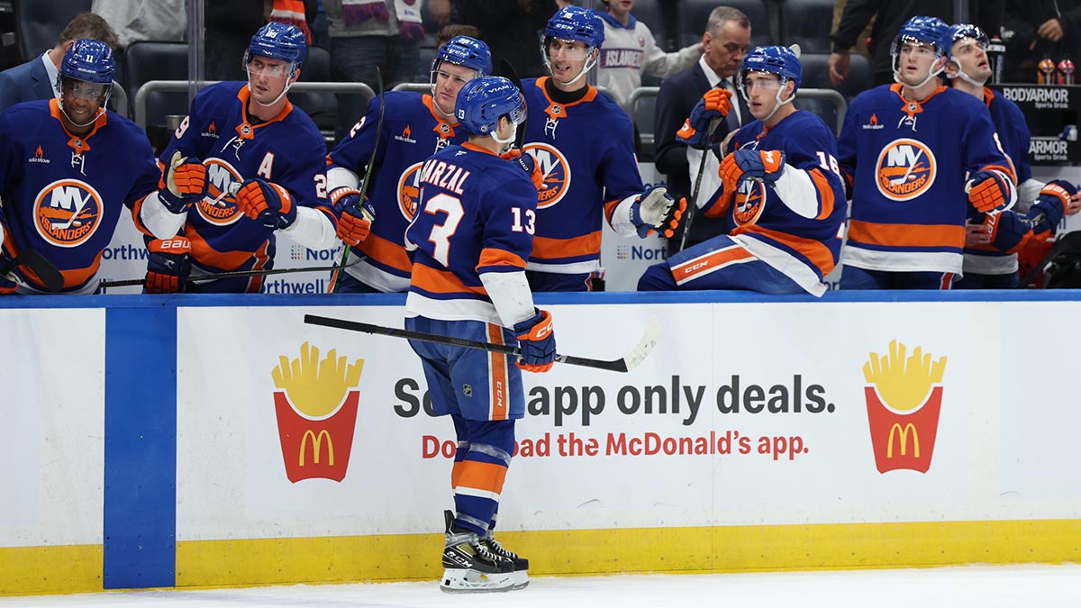 New York Islanders center Mathew Barzal (13) celebrates his goal against the San Jose Sharks during the second period at UBS Arena.