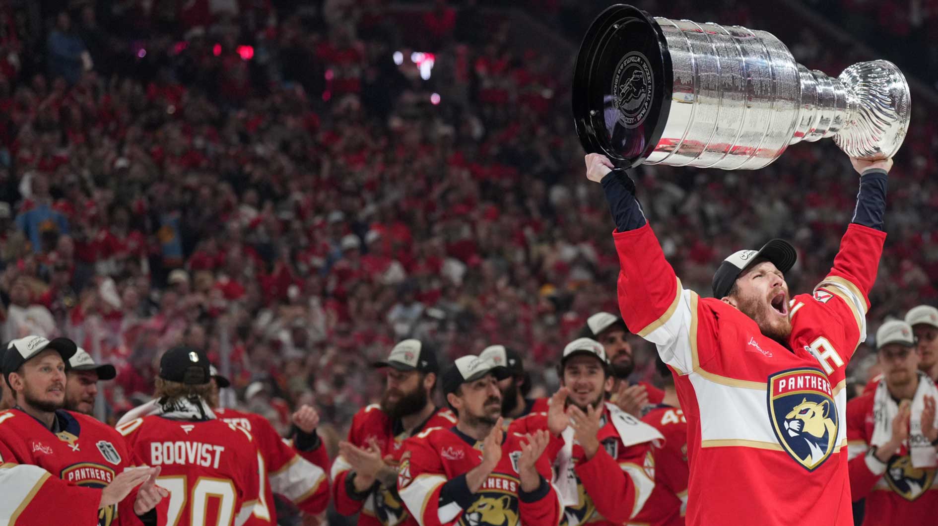 Florida Panthers left wing Matthew Tkachuk (19) hoist the Stanley Cup after game six of the 2025 Stanley Cup Final against the Edmonton Oilers at Amerant Bank Arena.
