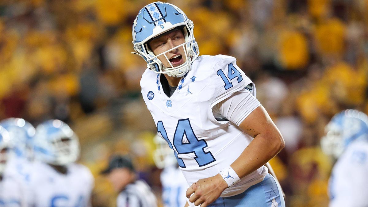 North Carolina Tar Heels quarterback Max Johnson (14) celebrates his rushing touchdown against the Minnesota Golden Gophers during the first half at Huntington Bank Stadium.