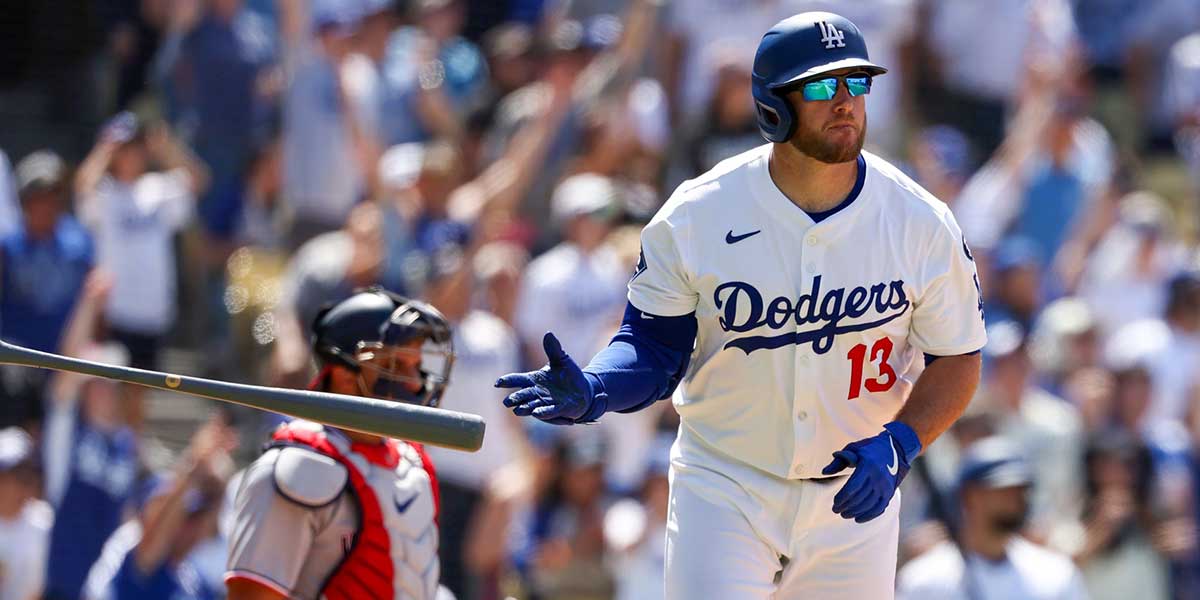 Jun 22, 2025; Los Angeles, California, USA; Los Angeles Dodgers third baseman Max Muncy (13) hits a three-run home run during the seventh inning against the Washington Nationals at Dodger Stadium.
