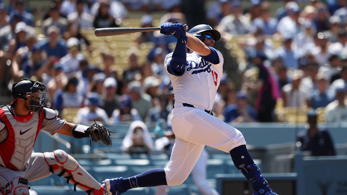 Jun 22, 2025; Los Angeles, California, USA; Los Angeles Dodgers third baseman Max Muncy (13) hits a three-run home run during the seventh inning against the Washington Nationals at Dodger Stadium.