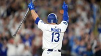 May 20, 2025; Los Angeles, California, USA; Los Angeles Dodgers third baseman Max Muncy (13) celebrates after hitting a sacrifice fly in the 10th inning against the Arizona Diamondbacks at Dodger Stadium. Mandatory Credit: Kirby Lee-Imagn Images