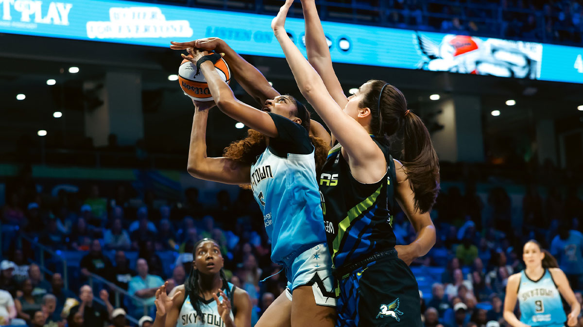 Chicago Sky forward Angel Reese (5) is blocked by Dallas Wings forward NaLyssa Smith (1) during the first half at College Park Center.