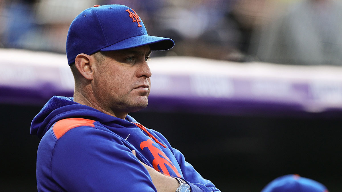 New York Mets manager Carlos Mendoza (64) looks on in the first inning against the Colorado Rockies at Coors Field.