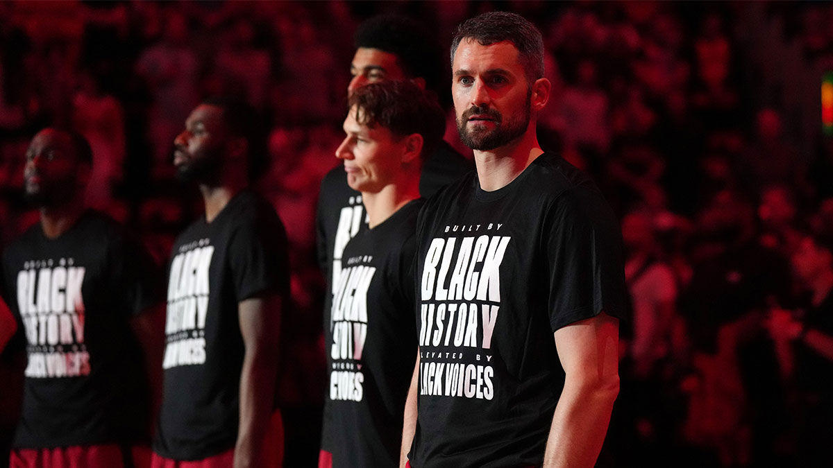 Feb 26, 2025; Miami, Florida, USA; Miami Heat forward Kevin Love (42) during pregame ceremonies before the game against the Atlanta Hawks at Kaseya Center. Mandatory Credit: Jim Rassol-Imagn Images