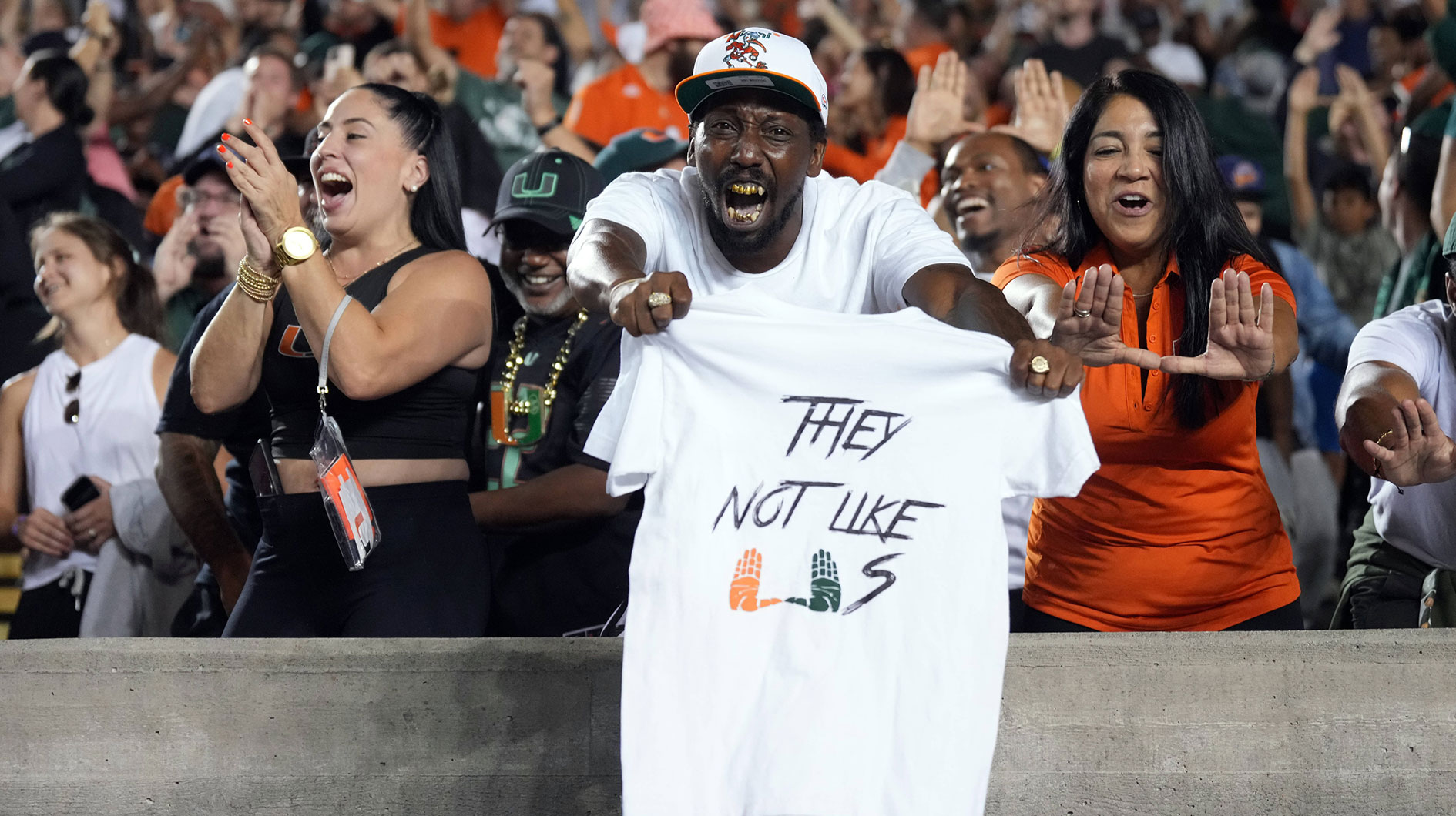 Miami Hurricanes fans cheer during the fourth quarter against the California Golden Bears at California Memorial Stadium.