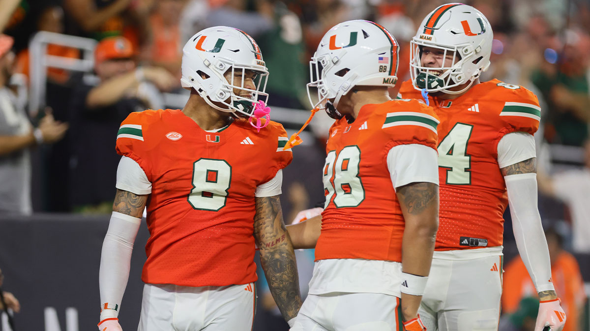 Miami Hurricanes tight end Elijah Arroyo (8) celebrates with tight end Riley Williams (88) after scoring a touchdown against the Virginia Tech Hokies during the first quarter at Hard Rock Stadium.