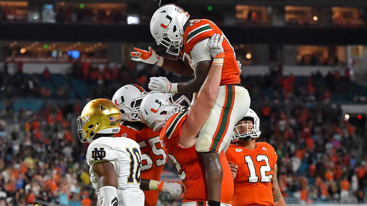 Miami Hurricanes quarterback DeeJay Dallas (13) celebrates his touchdown against the Notre Dame Fighting Irish during the second half at Hard Rock Stadium.