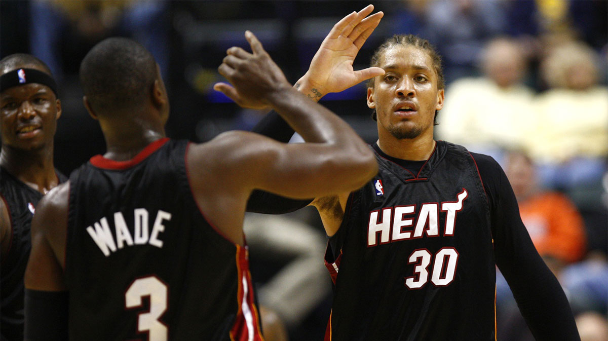 Miami Heat forward Michael Beasley (30) is congratulated by guard Dwyane Wade (3) during the third quarter against in the Indiana Pacers at Conseco Fieldhouse in Indianapolis, IN. Miami won 96-83.