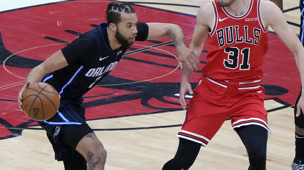 Orlando Magic guard Michael Carter-Williams (7) dribbles the ball against Chicago Bulls guard Tomas Satoransky (31) during the first quarter at the United Center.