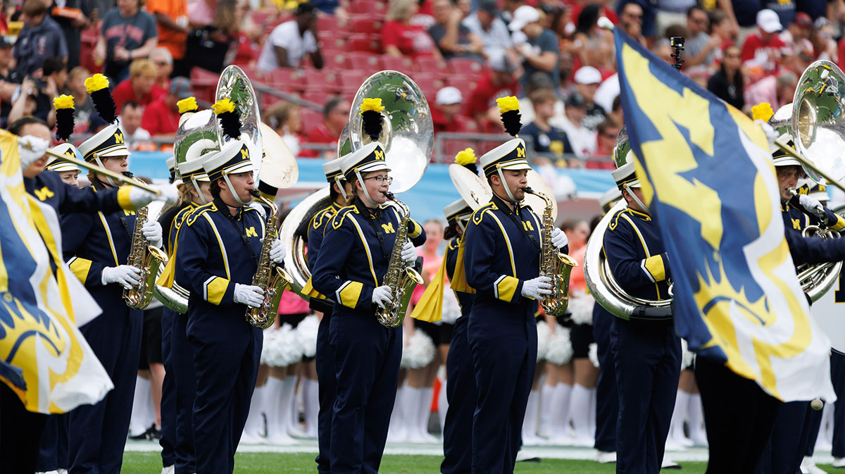 Michigan Wolverines band members play before a game against the Alabama Crimson Tide at Raymond James Stadium.