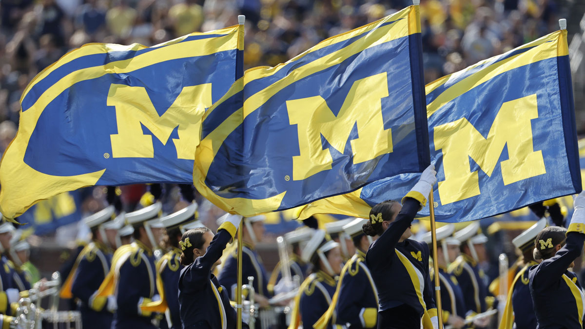 Michigan Wolverines marching band take the field before a game against the Arkansas State Red Wolves at Michigan Stadium.