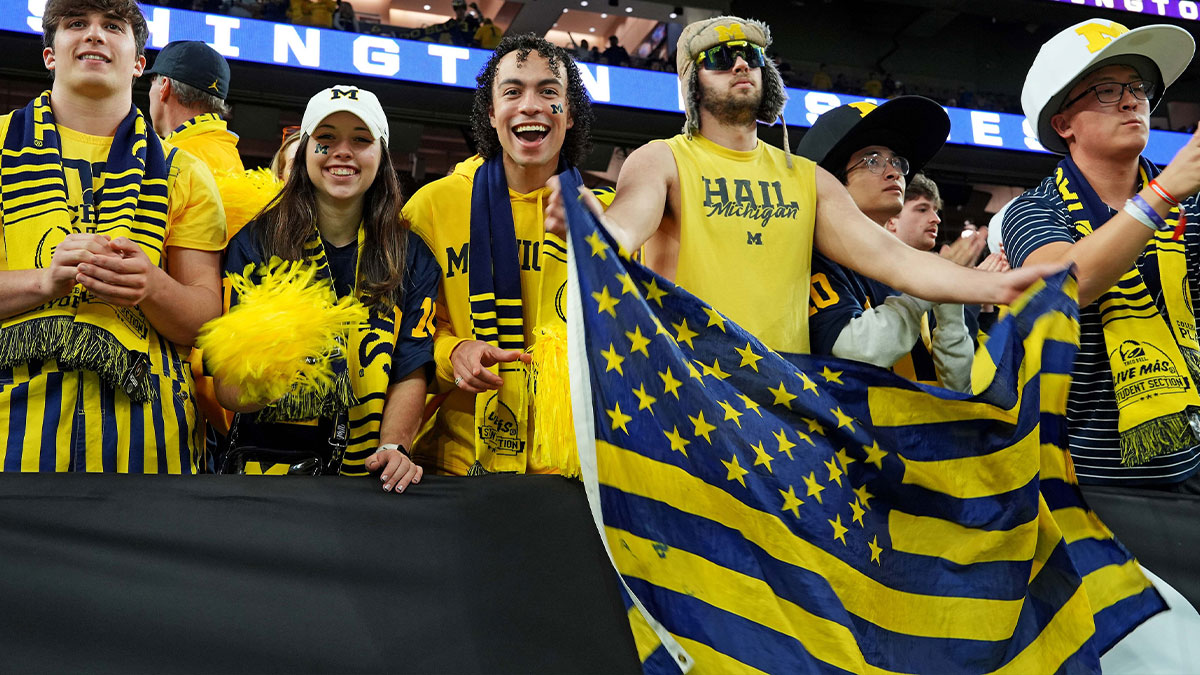 Michigan Wolverines fans cheers before the 2024 College Football Playoff national championship game between the Michigan Wolverines and the Washington Huskies at NRG Stadium.