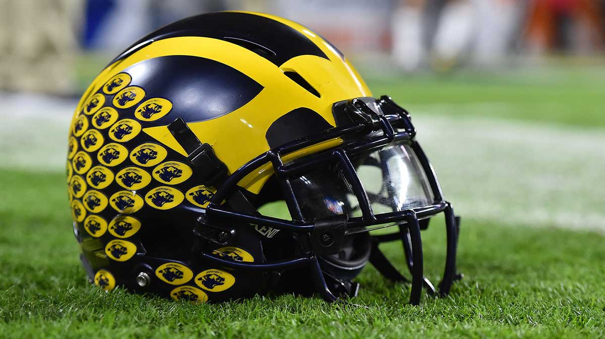 A Michigan Wolverines football helmet sits on the field prior to the game between the Florida State Seminoles and the Michigan Wolverines at Hard Rock Stadium.