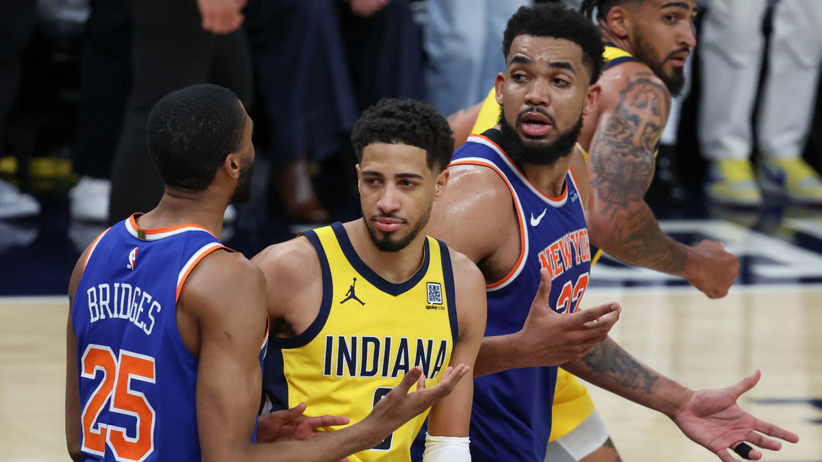 New York Knicks center Karl-Anthony Towns (32) and forward Mikal Bridges (25) speak in the fourth quarter during game six of the eastern conference finals against the Indiana Pacers for the 2025 NBA Playoffs at Gainbridge Fieldhouse.