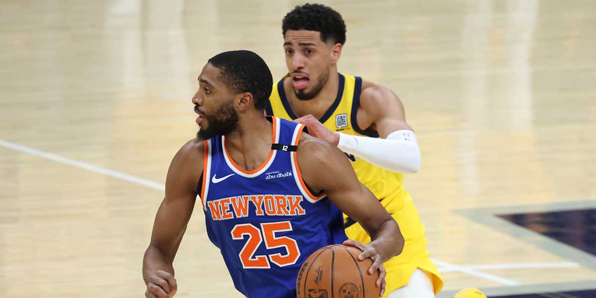 New York Knicks forward Mikal Bridges (25) dribbles the ball defended by New York Knicks guard Delon Wright (0) in the first quarter during game six of the eastern conference finals for the 2025 NBA Playoffs at Gainbridge Fieldhouse.