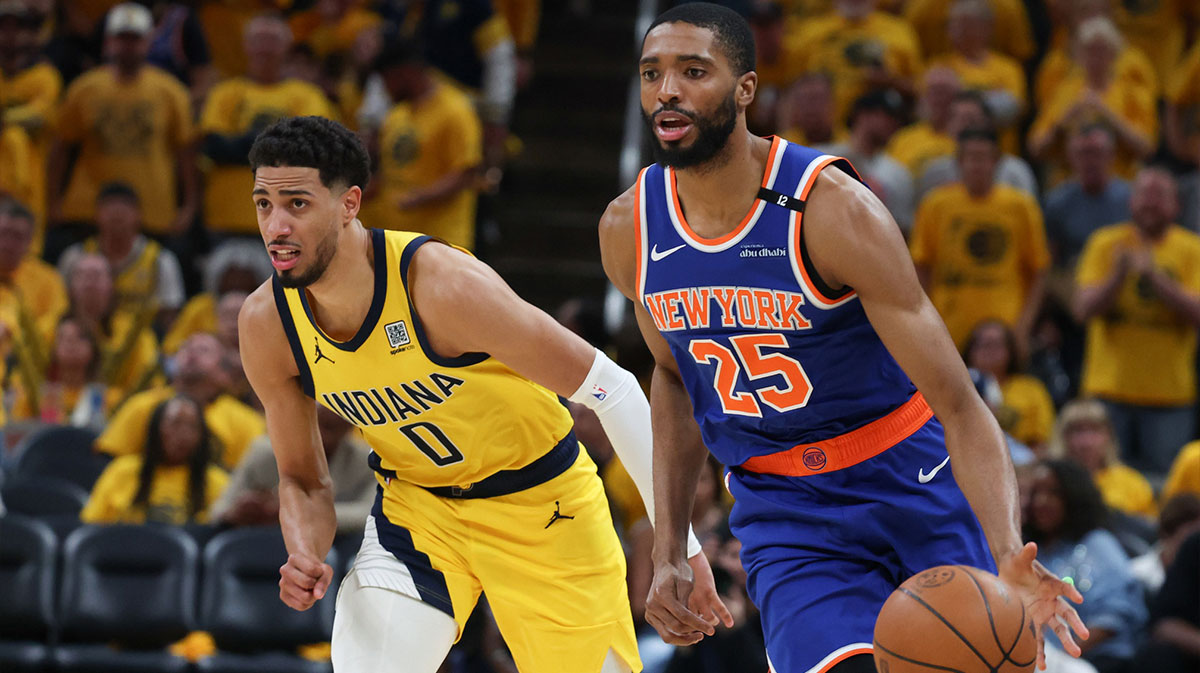 New York Knicks forward Mikal Bridges (25) dribbles the ball defended by Indiana Pacers guard Tyrese Haliburton (0) in the third quarter during game six of the eastern conference finals for the 2025 NBA Playoffs at Gainbridge Fieldhouse.