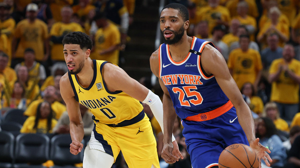 New York Knicks forward Mikal Bridges (25) dribbles the ball defended by Indiana Pacers guard Tyrese Haliburton (0) in the third quarter during game six of the eastern conference finals for the 2025 NBA Playoffs at Gainbridge Fieldhouse.
