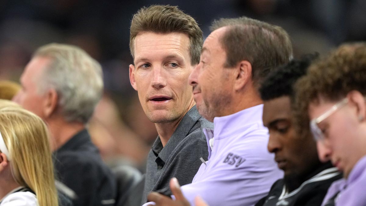 Golden State Warriors general manager Mike Dunleavy (center left) talks with Golden State Valkyries co-owner Joe Lacob (center right) during the fourth quarter against the Indiana Fever at Chase Center.